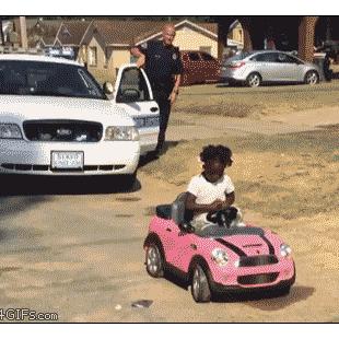 A girl runs away from a cop.