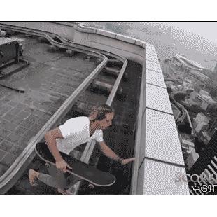 Skateboarding on high roof ledge