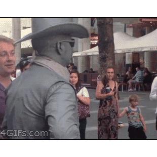 Jerk-bothers-cowboy-street-performer