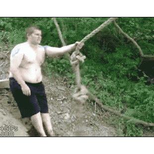 A fat guy tries swinging on a rope.