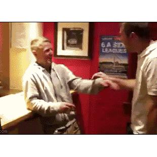 A drunk guy tries to lean on a counter.