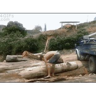 Strong-man-lifts-tree-trunk-log