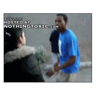 Girl punches guy.